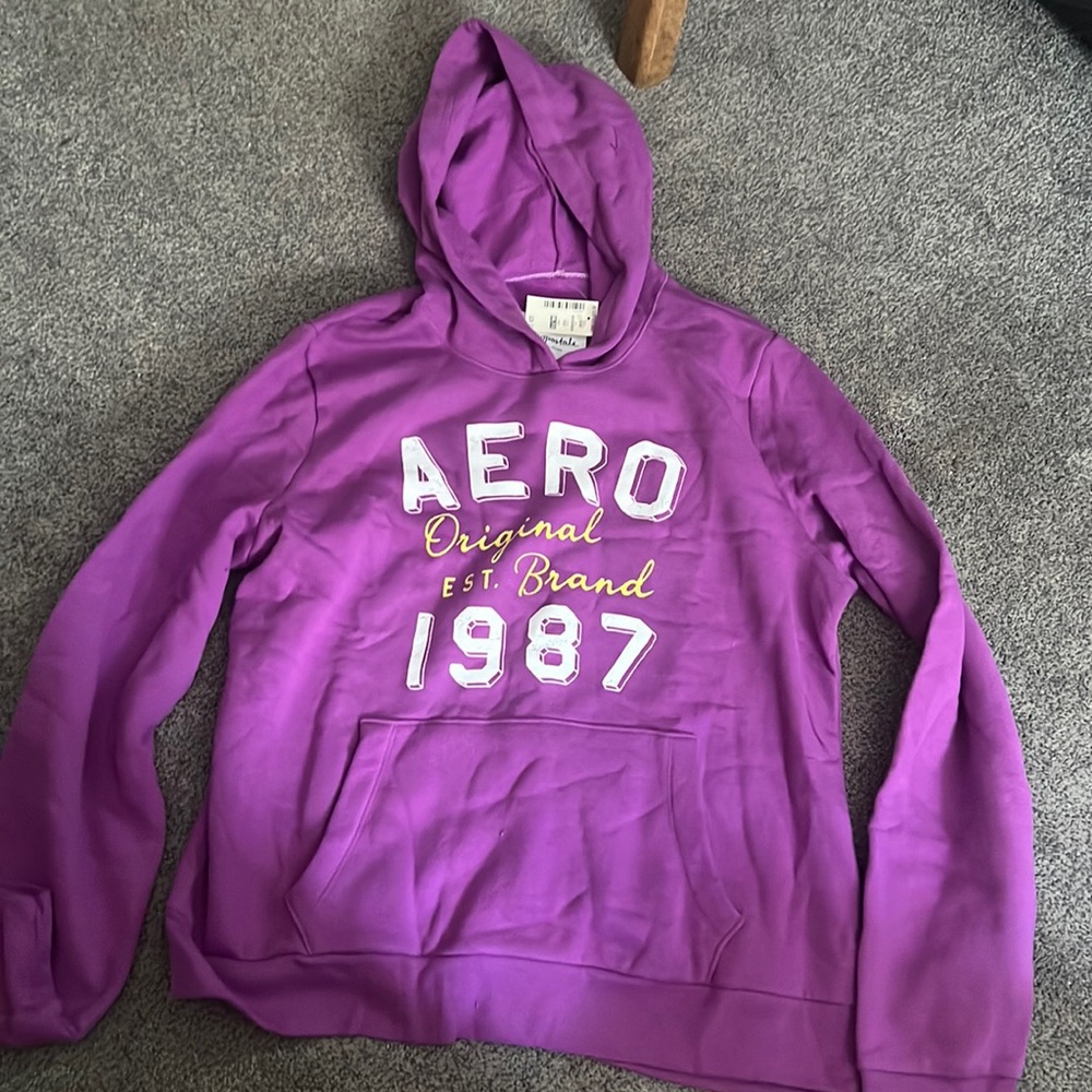 Aeropostale purple sweatshirt with white and yellow lettering.